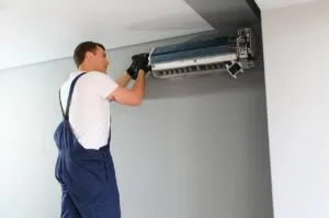 technician repairing air conditioner on the wall 2023 11 27 05 07 08 utc 300x199 1