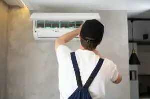 service man is cleaning repair and maintenance of 2024 03 12 20 30 41 utc 300x199 1