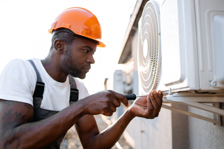 rsz craftsman repairing air conditioner with screwdriv 2023 12 21 22 01 43 utc